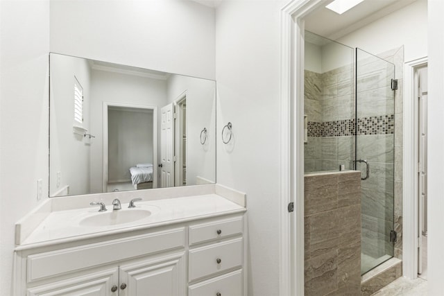 bathroom featuring vanity, an enclosed shower, and crown molding