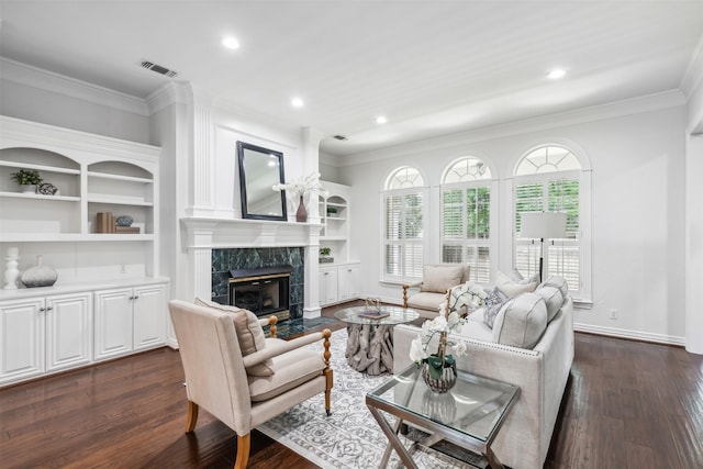 living room featuring dark hardwood / wood-style flooring, crown molding, and a high end fireplace