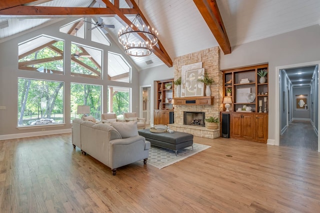 living room with beamed ceiling, hardwood / wood-style floors, and high vaulted ceiling