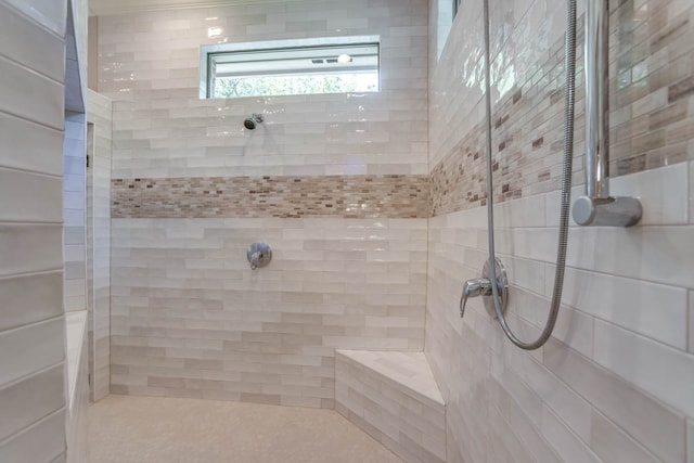 bathroom with tiled shower