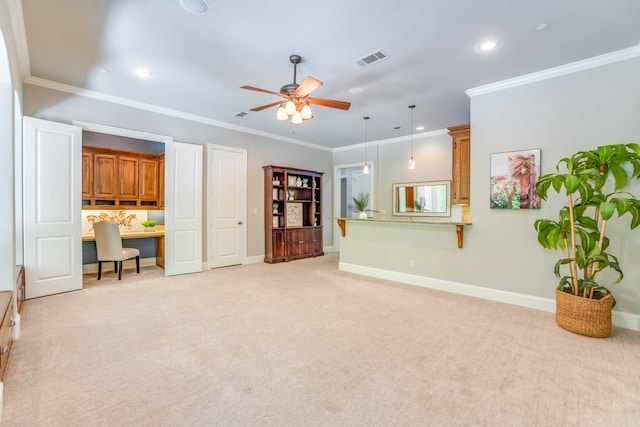 living room featuring light colored carpet, crown molding, built in desk, and ceiling fan