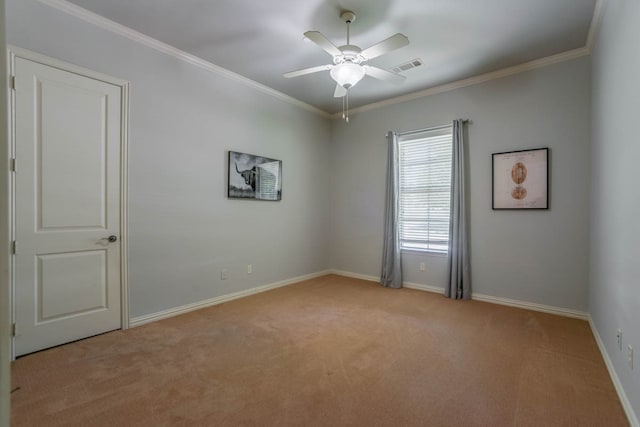 unfurnished room with crown molding, light colored carpet, and ceiling fan