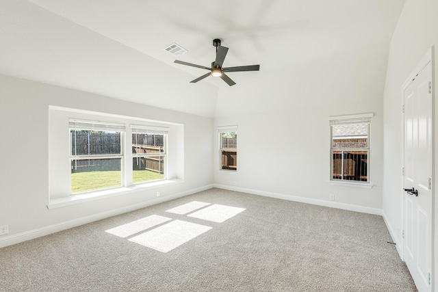 carpeted spare room featuring ceiling fan and high vaulted ceiling