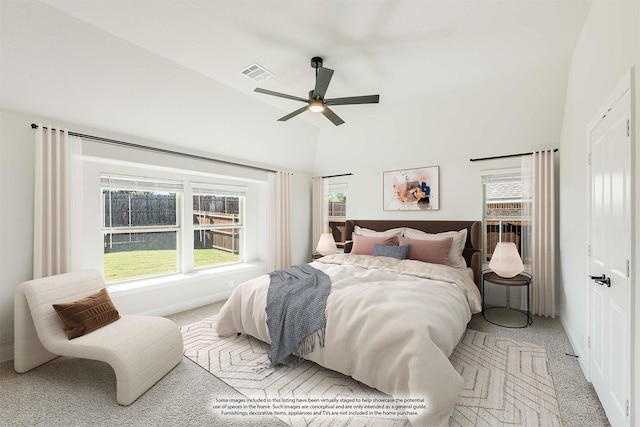 bedroom featuring ceiling fan, light carpet, and vaulted ceiling