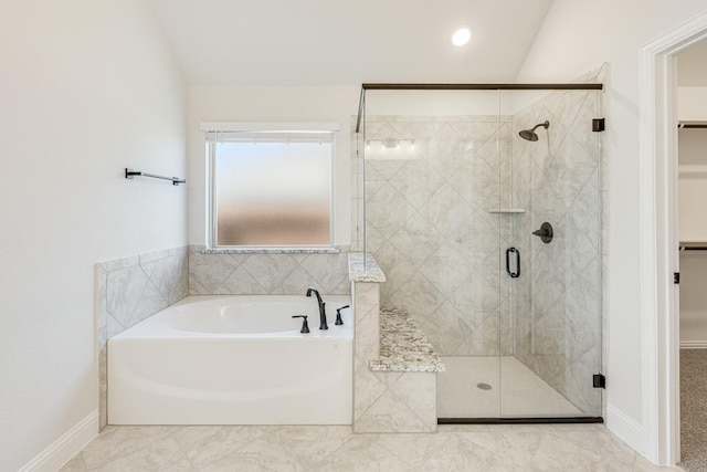 bathroom featuring tile patterned floors, independent shower and bath, and vaulted ceiling