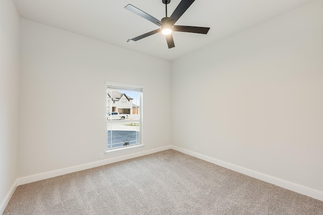 unfurnished room with carpet flooring and ceiling fan