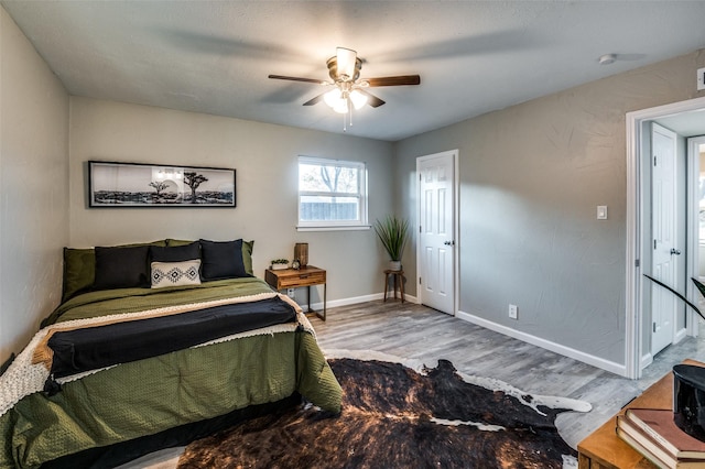 bedroom featuring hardwood / wood-style flooring and ceiling fan