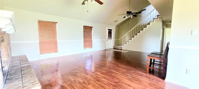 unfurnished living room featuring high vaulted ceiling, ceiling fan, and hardwood / wood-style flooring