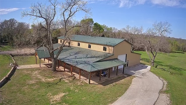 surrounding community with a patio and a lawn