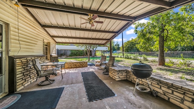 view of patio with ceiling fan and a grill