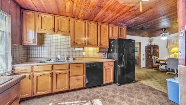 kitchen featuring light countertops, backsplash, a sink, ceiling fan, and black appliances