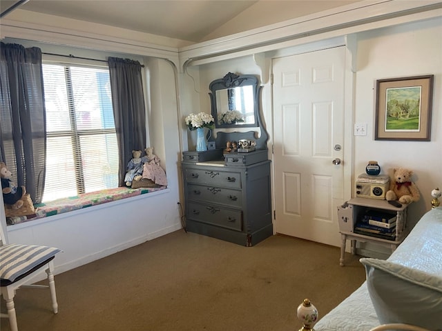 carpeted bedroom featuring vaulted ceiling