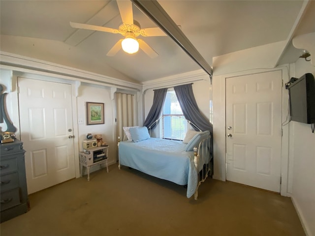 bedroom featuring dark carpet, ceiling fan, and vaulted ceiling