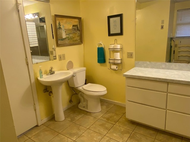 bathroom featuring toilet and tile flooring