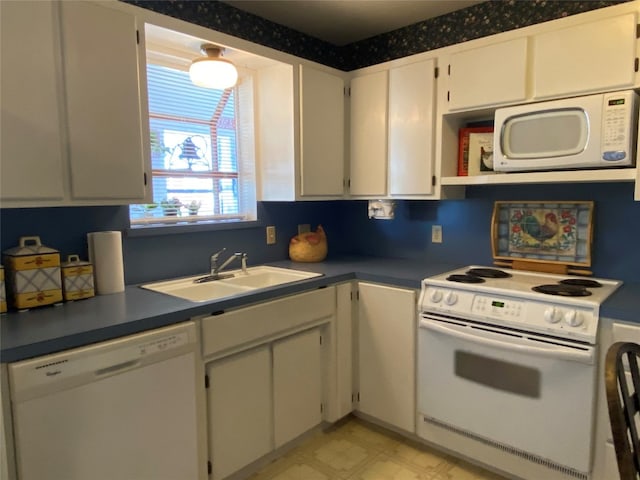 kitchen featuring white cabinetry, light tile floors, white appliances, and sink