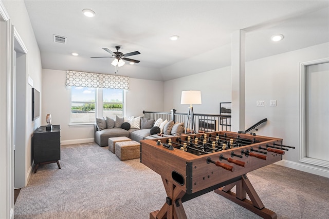 playroom with vaulted ceiling, ceiling fan, and light colored carpet