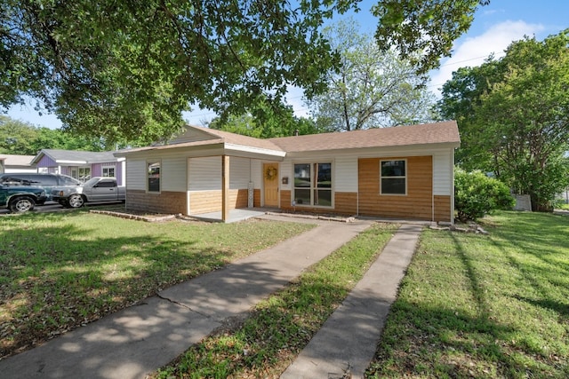 single story home with a front yard