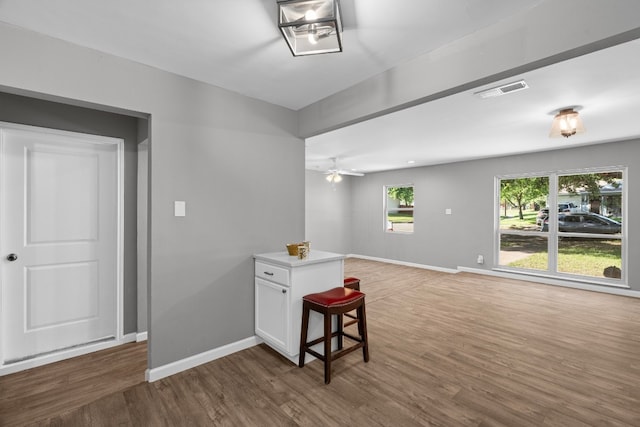 empty room featuring dark hardwood / wood-style flooring and ceiling fan