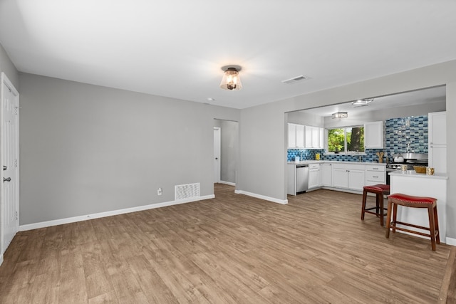 unfurnished living room featuring light hardwood / wood-style flooring