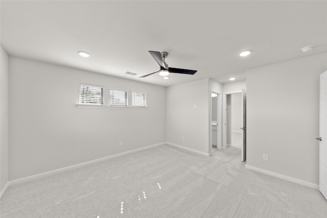 interior space featuring ceiling fan and light carpet