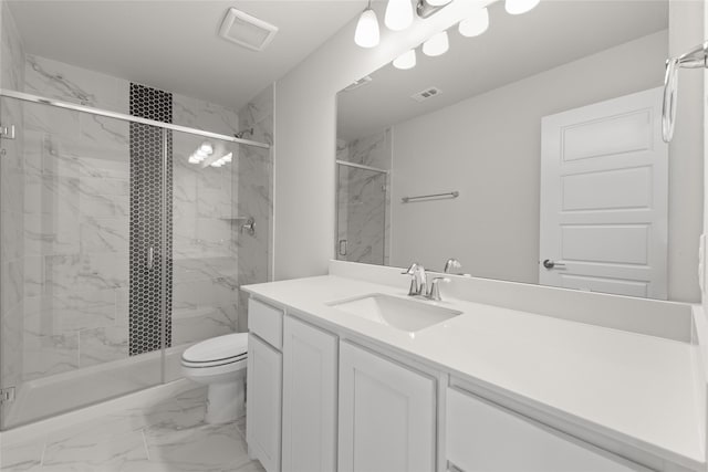 bathroom with vanity, toilet, and walk in shower