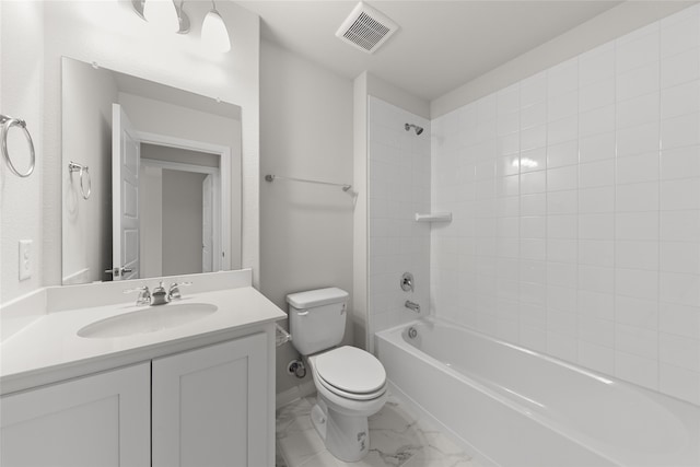 full bathroom featuring vanity, toilet, and tiled shower / bath