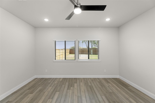 empty room featuring ceiling fan and light wood-type flooring