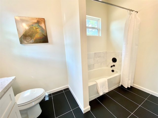 bathroom featuring vanity, tile patterned floors, and toilet