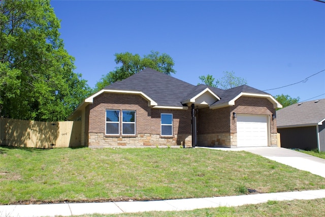 single story home featuring brick siding, stone siding, a front lawn, and a garage