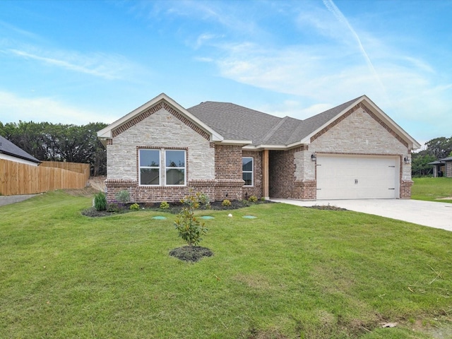 view of front of home featuring a front lawn and a garage