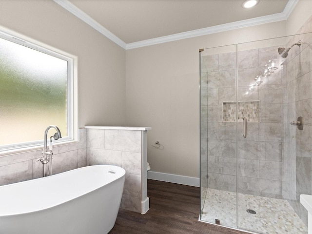 bathroom featuring crown molding, tile walls, separate shower and tub, and hardwood / wood-style flooring