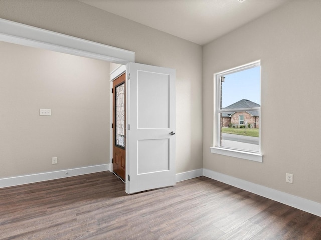 unfurnished room featuring hardwood / wood-style flooring