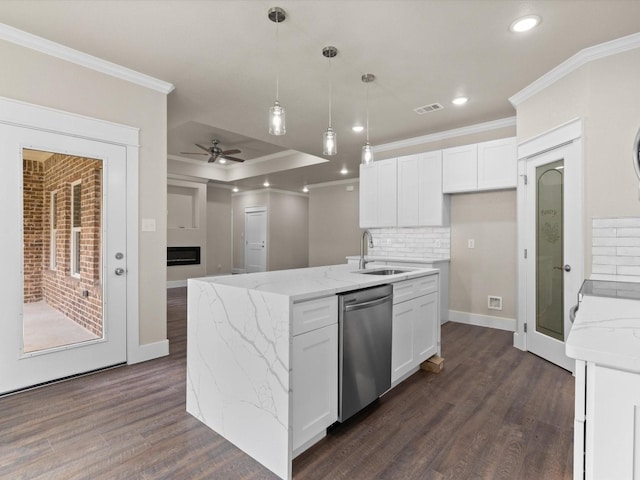 kitchen with dark hardwood / wood-style flooring, white cabinetry, and stainless steel dishwasher