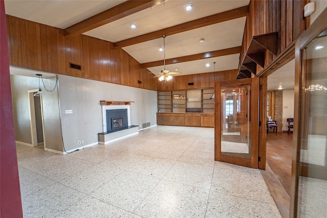 unfurnished living room with beamed ceiling, high vaulted ceiling, ceiling fan, and light tile floors