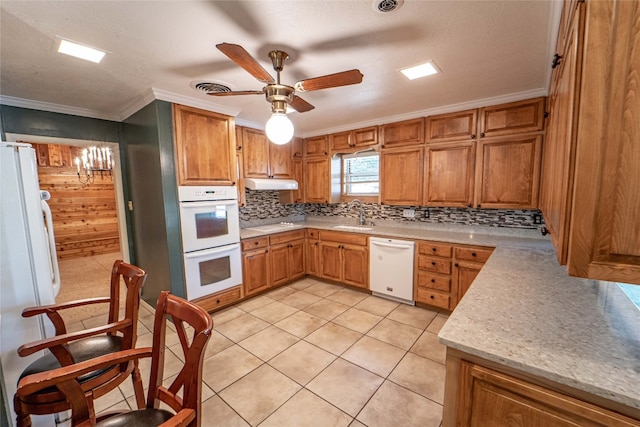 kitchen featuring ceiling fan, white appliances, light tile flooring, tasteful backsplash, and crown molding