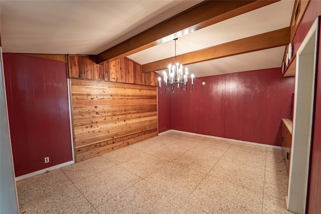 empty room with wood walls, lofted ceiling with beams, a notable chandelier, and light tile flooring