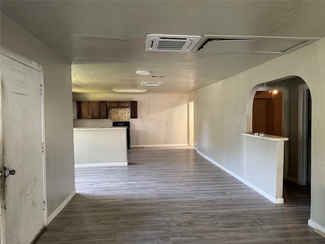 hallway with dark hardwood / wood-style flooring