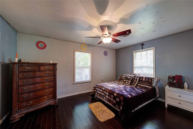 bedroom featuring ceiling fan and dark hardwood / wood-style flooring