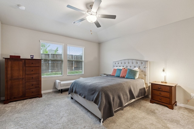 carpeted bedroom with lofted ceiling and ceiling fan