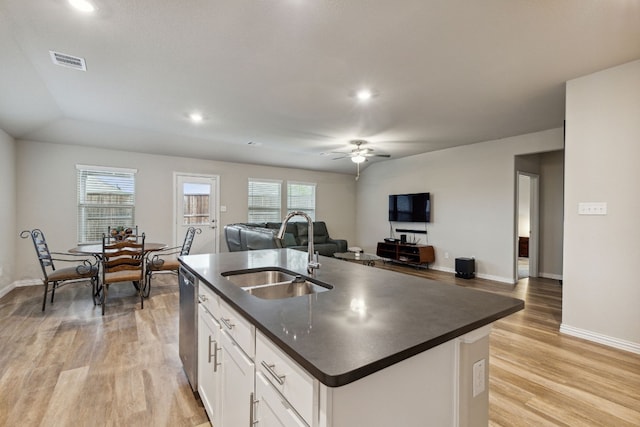 kitchen featuring a center island with sink, ceiling fan, light hardwood / wood-style floors, white cabinetry, and sink