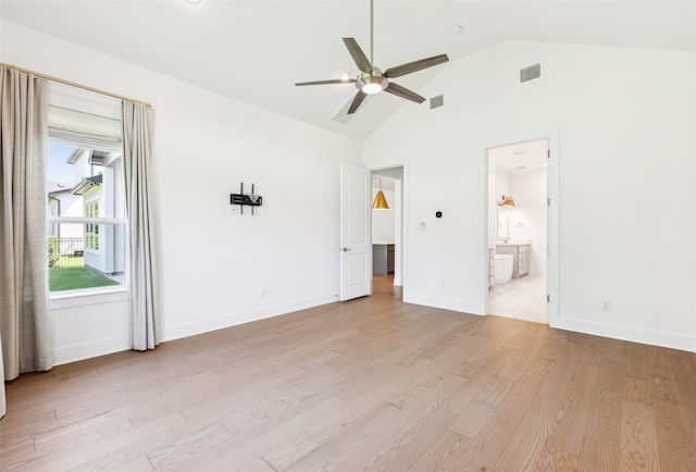 unfurnished bedroom with ceiling fan, light hardwood / wood-style flooring, high vaulted ceiling, and ensuite bathroom