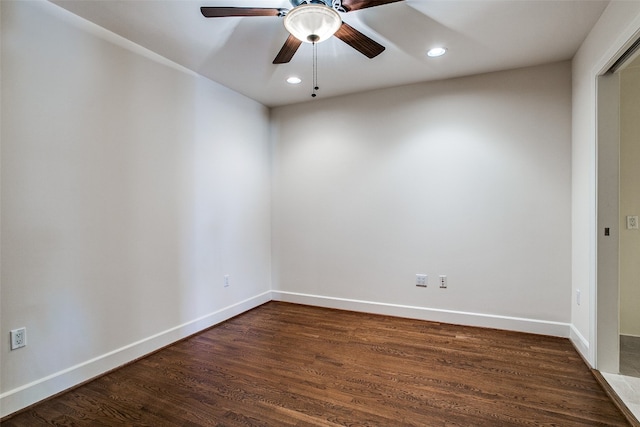 unfurnished room featuring dark hardwood / wood-style flooring and ceiling fan