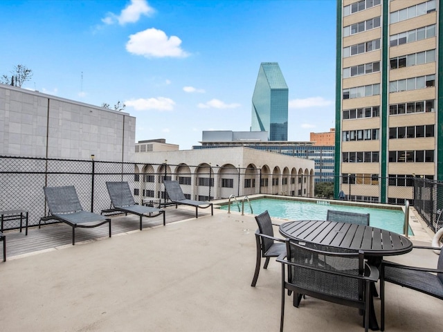 view of terrace with a community pool