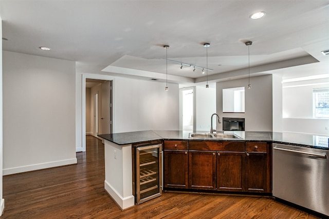 kitchen with decorative light fixtures, dark wood-type flooring, wine cooler, sink, and stainless steel dishwasher