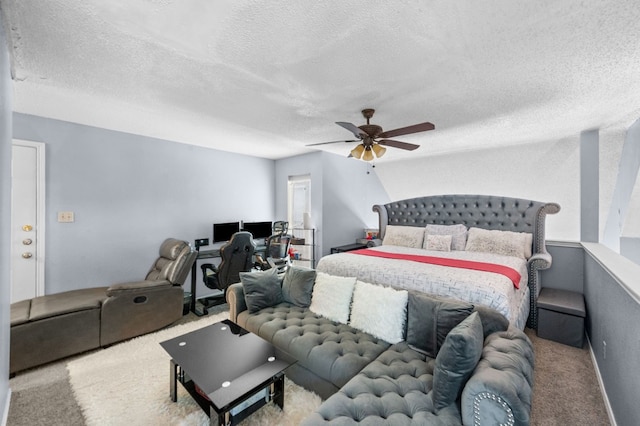 carpeted bedroom featuring a textured ceiling and ceiling fan