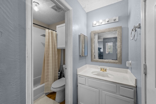 full bathroom featuring vanity, shower / bathtub combination with curtain, hardwood / wood-style flooring, toilet, and a textured ceiling