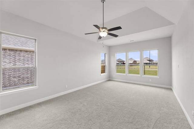 unfurnished room with ceiling fan and light colored carpet