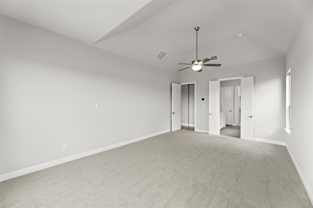 interior space featuring lofted ceiling, ceiling fan, and carpet flooring