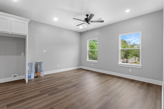 unfurnished living room with ceiling fan and dark hardwood / wood-style floors