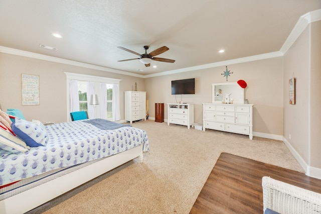 bedroom featuring ceiling fan, carpet flooring, and ornamental molding